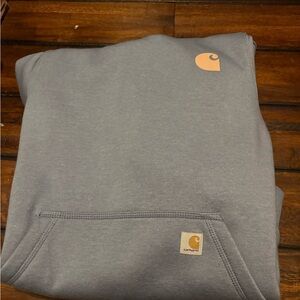 Carhartt women's light blue Hoodie with salmon colored Logo